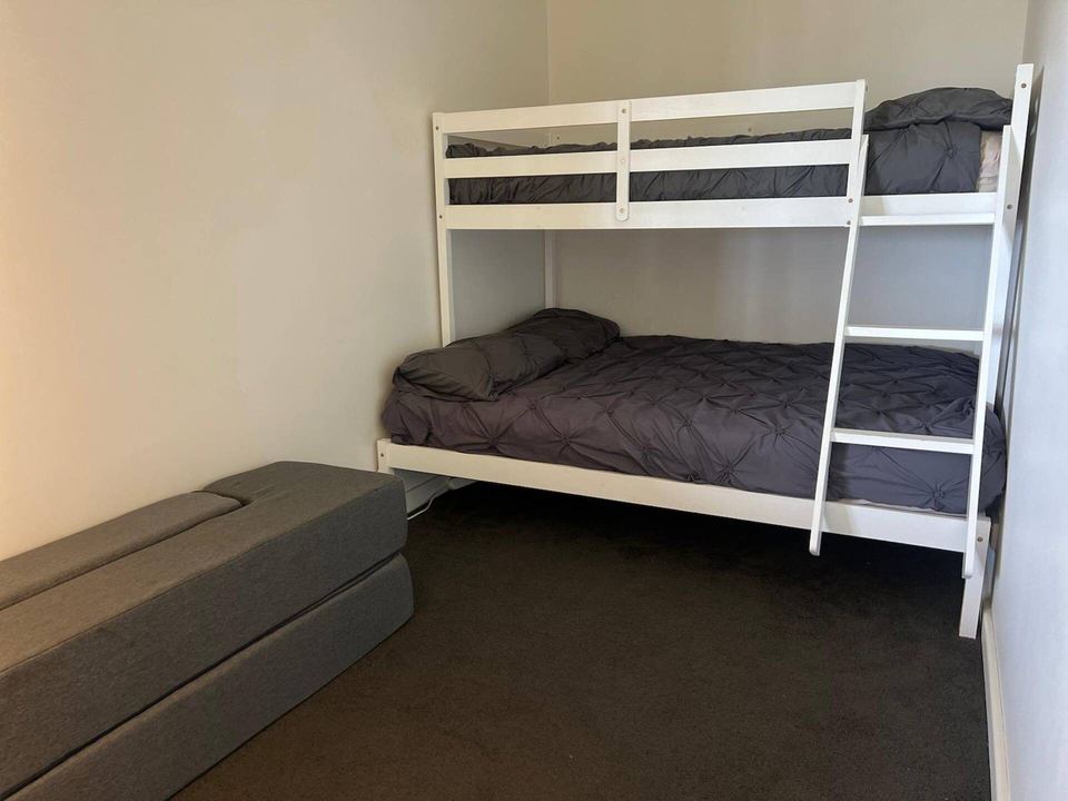 Bunk room with double-bottom bunk for kids