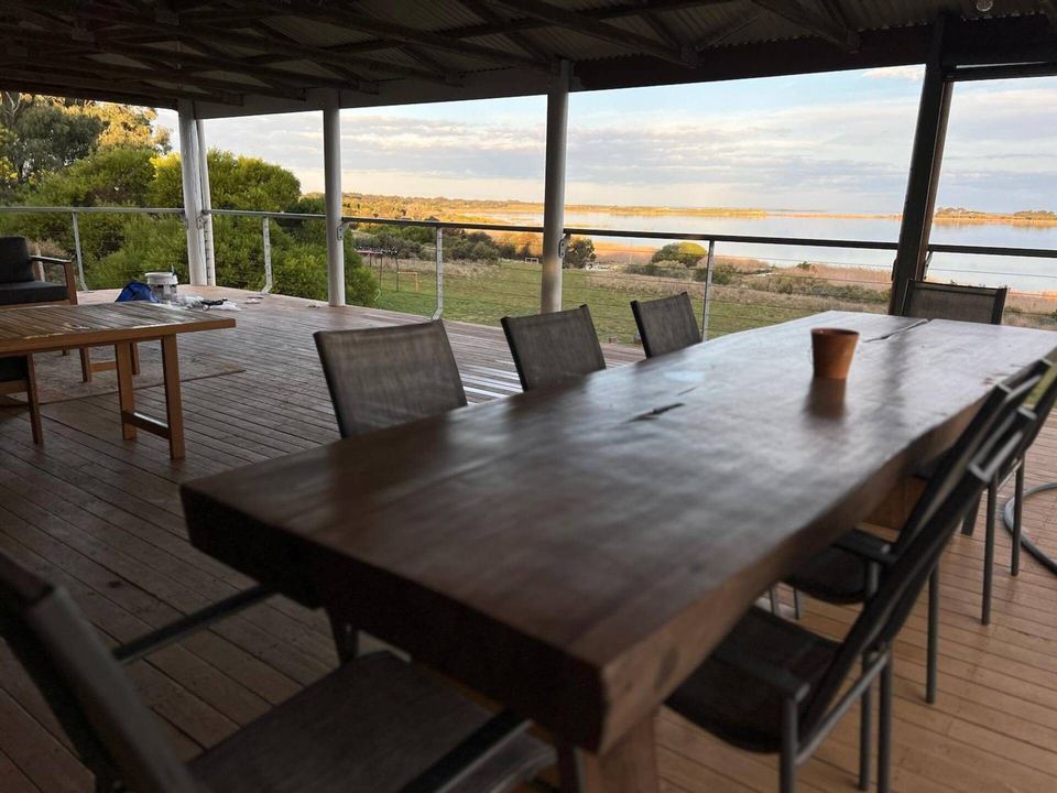 Outdoor dining table on the lakefront deck