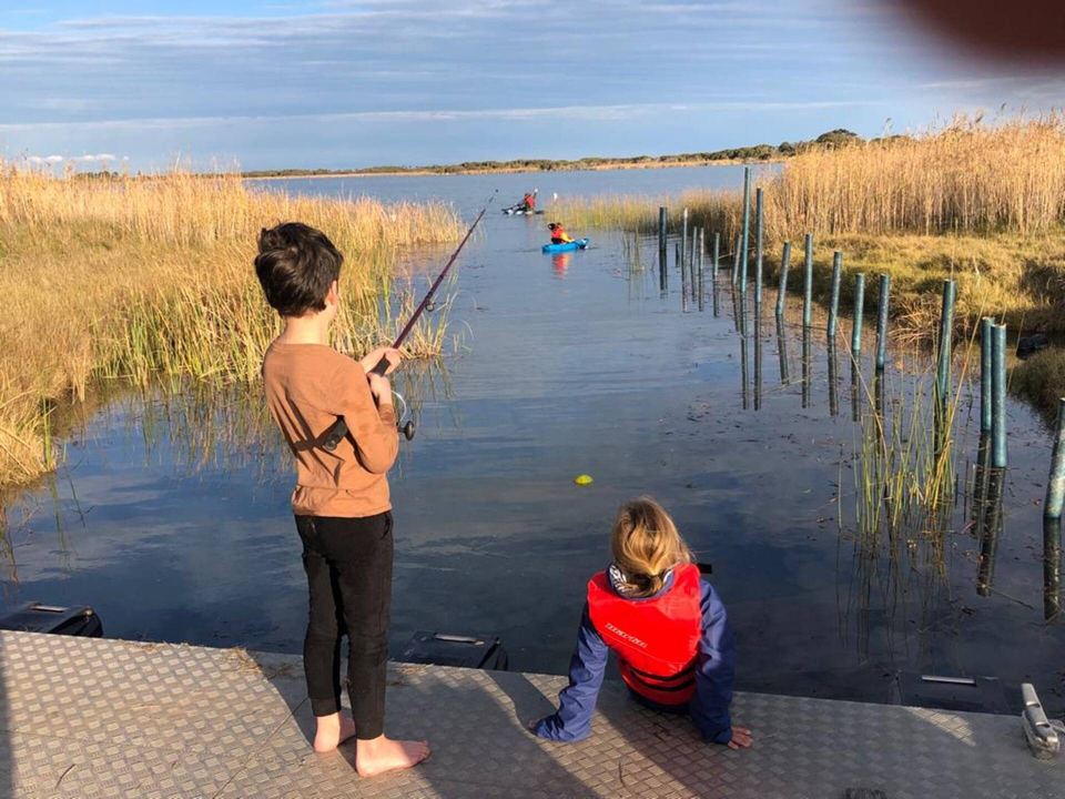 Kids fishing from the jetty