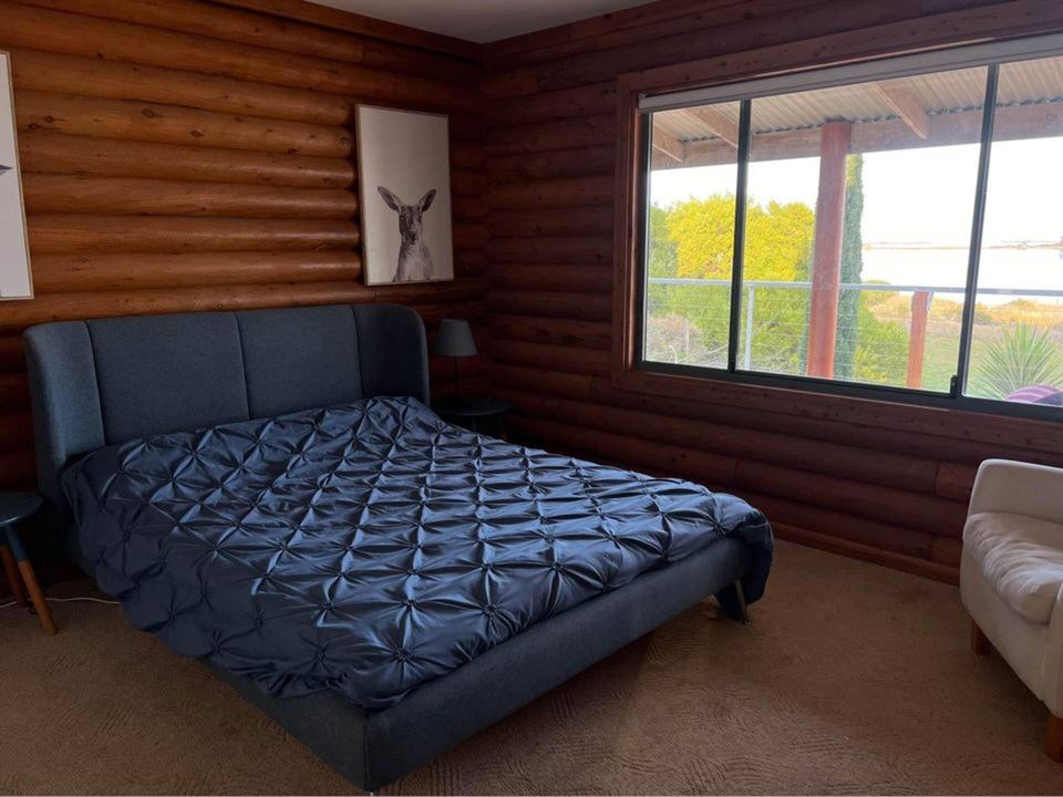 Bedroom with queen bed and garden window