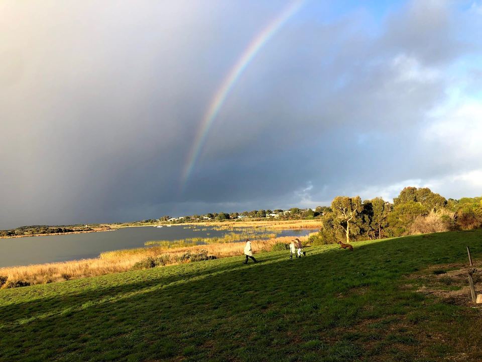Rainbow over the lake and lawn at Clayton Bay